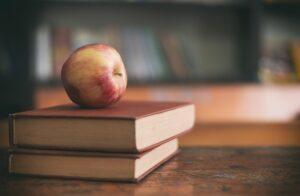 Apple on top of two books