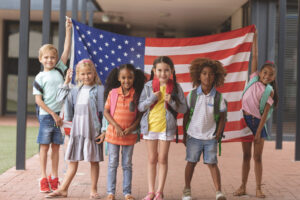 Children holding an American flag